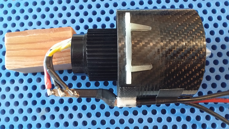 The assembly is bonded to the impeller mantle and the motor wires are soldered